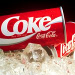 Coke Cans featuring updated design by Landor & Associates